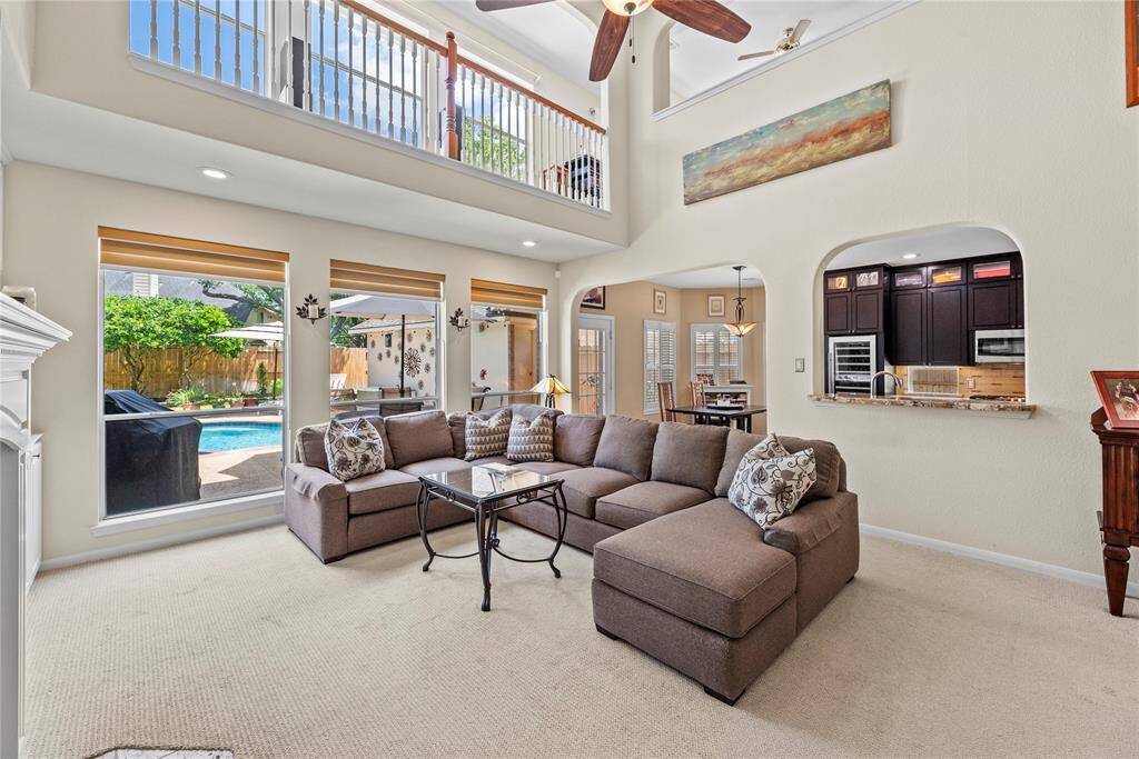 Alternate view of the family room showcasing the open floor plan seamlessly connecting to the kitchen and breakfast nook.