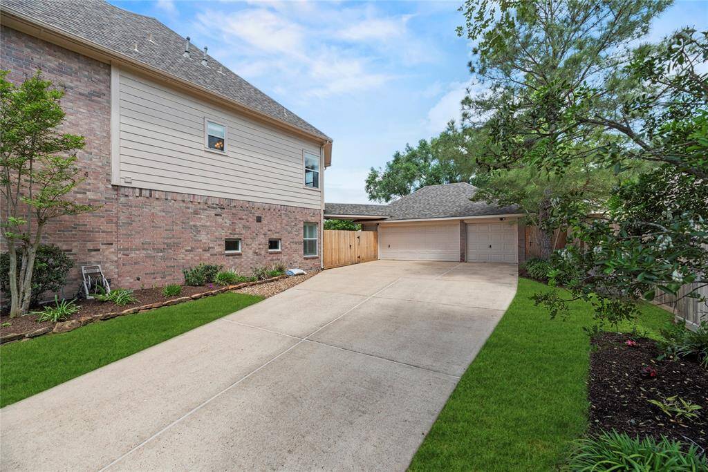 Spacious and long driveway going to the three car garage.