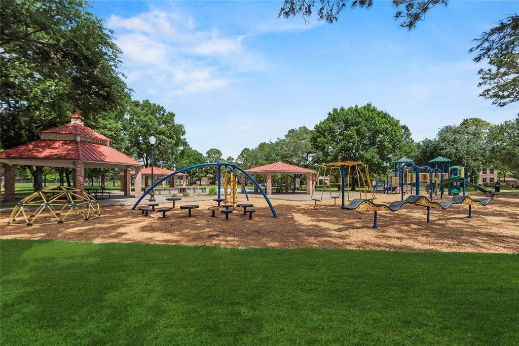 Before you enter the home on a large pie shaped lot you see one of the community parks with a playground, pavilion and  splash pad. area directly across the street