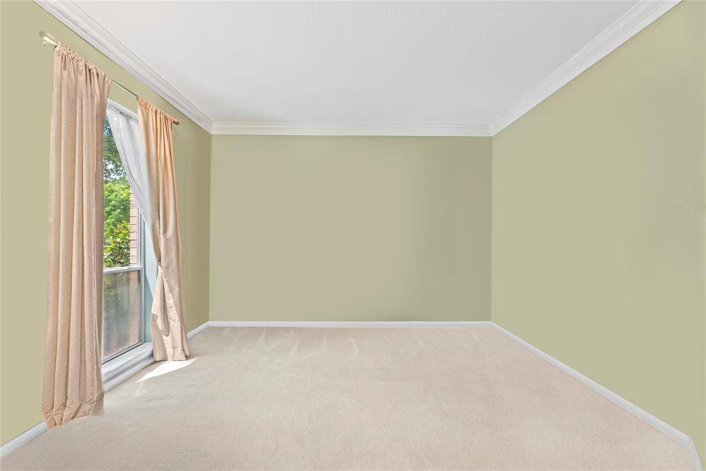 Spacious flex room with views of the front of the home that can easily be transformed into a home office, formal sitting area, or playroom.