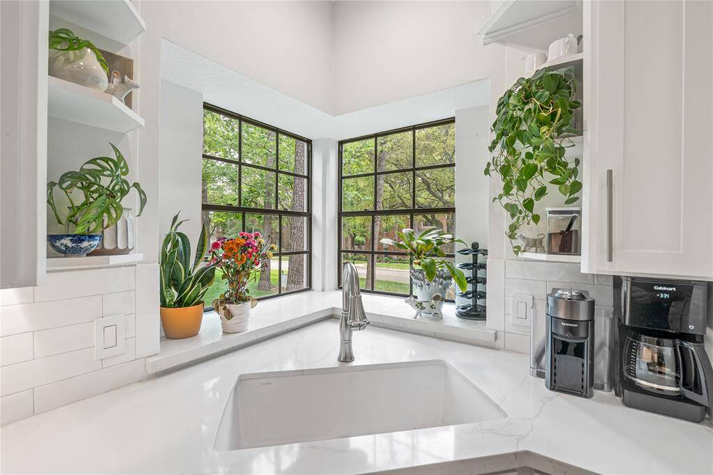 Thoughtful details are found throughout the home, including beautiful views of the lush front yard right from the kitchen window.