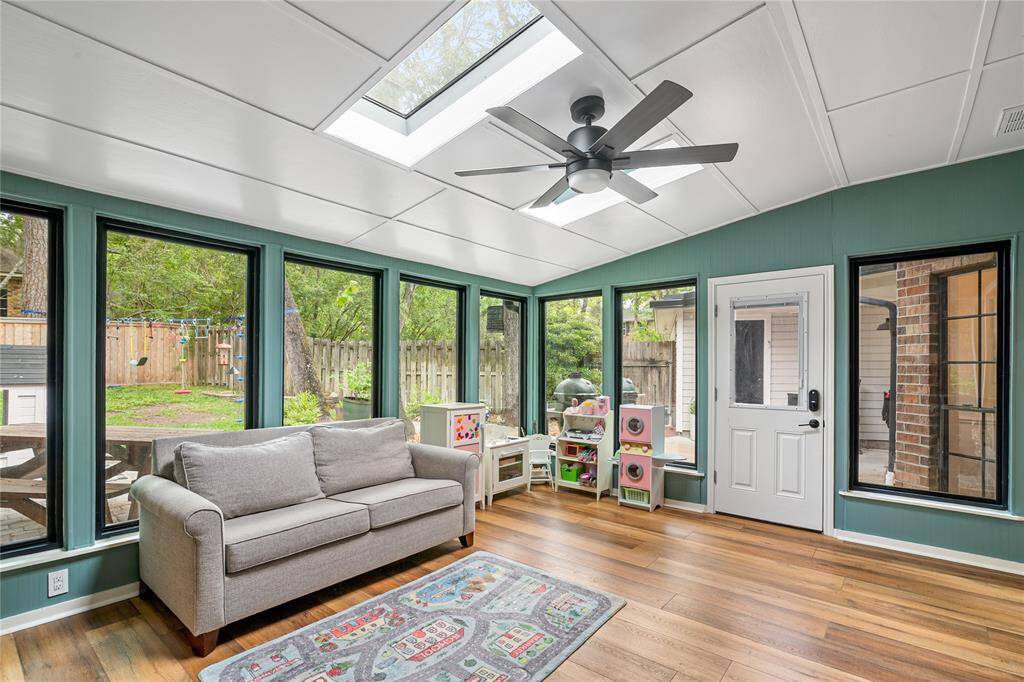 The sunroom just off the family room is both beautiful and functional—flooded with natural light and offering a peaceful space to relax, entertain, or enjoy the backyard views.