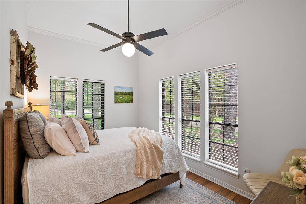 This bright and inviting bedroom is filled with natural light, creating a warm and relaxing retreat.
