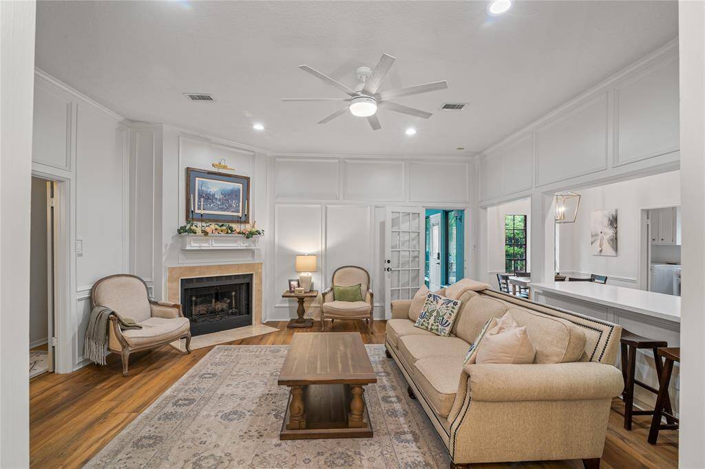 Wow-worthy in every way, the spacious family room impresses with rich wood paneling and a seamless connection to the chef’s kitchen—perfect for gatherings and everyday living.