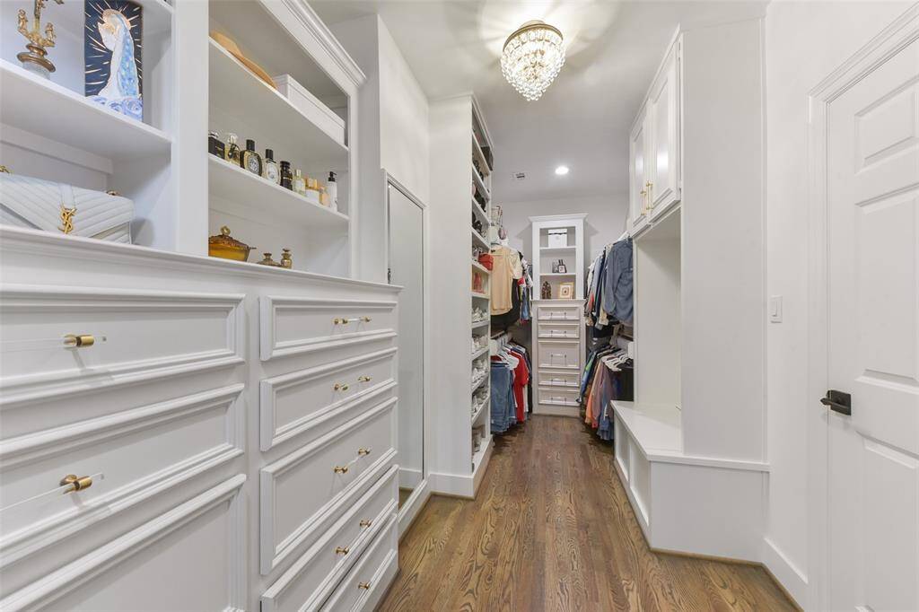 Custom cabinetry in dual closets to maximize storage and efficiency.