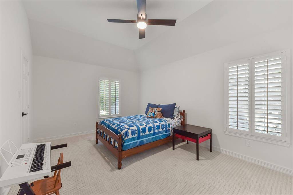 Additional bedroom with tall ceilings and large closet.