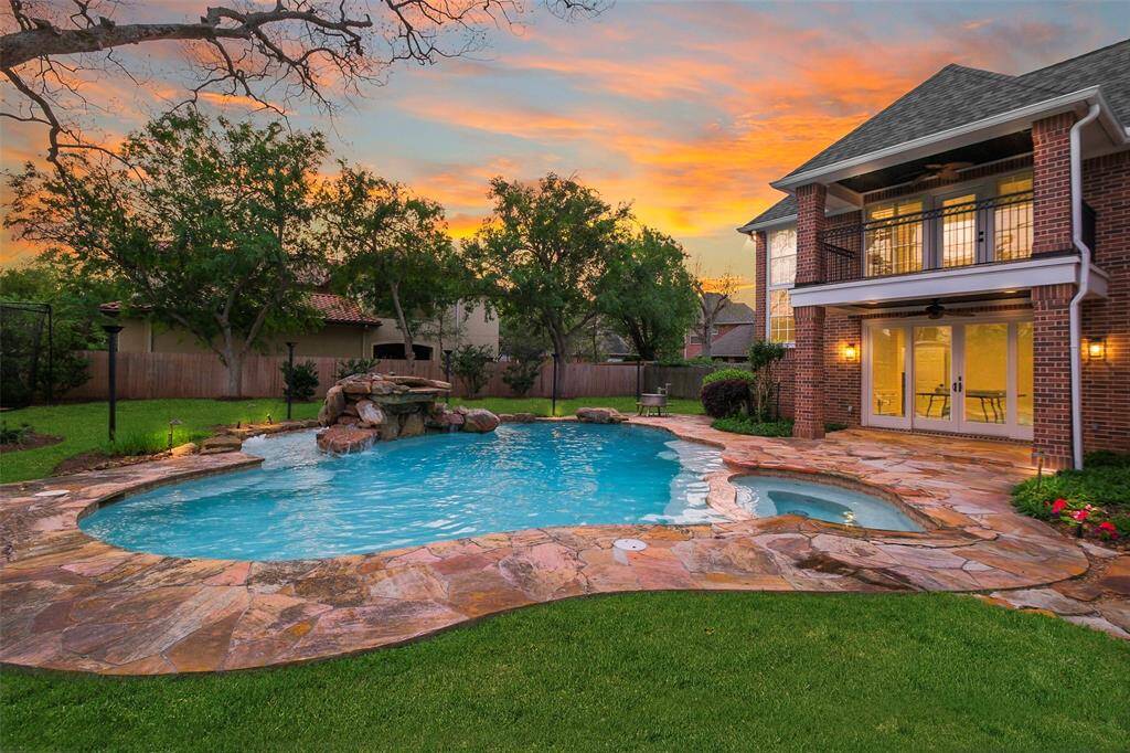 Beat the Texas heat in the shimmering pool with multiple ledges and areas for sitting and tanning.