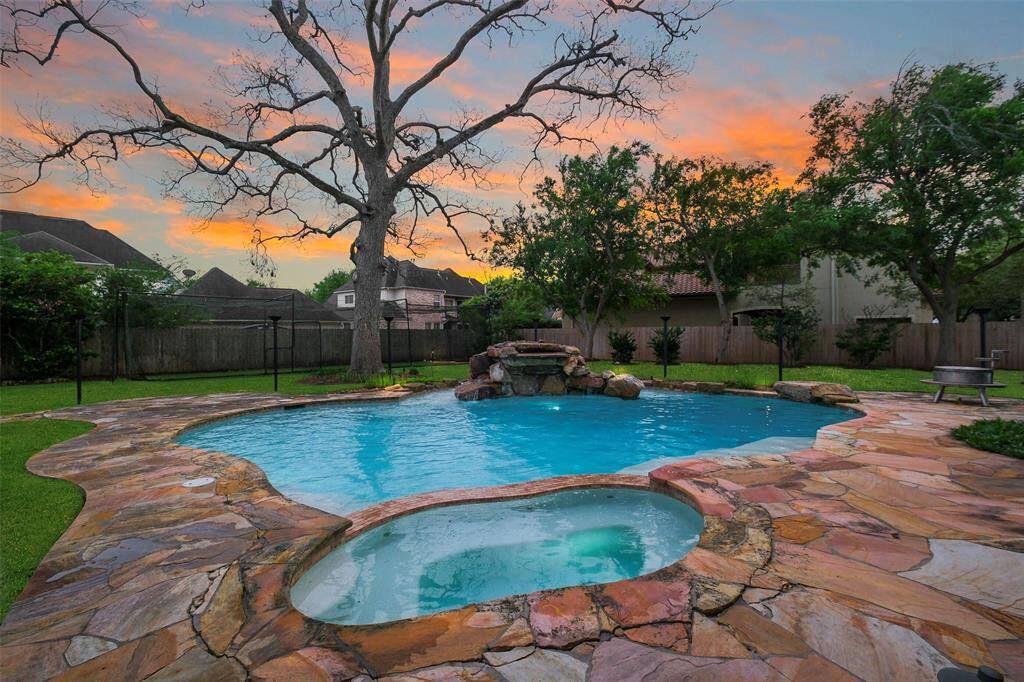 Large pool with water fall and built-in spa.