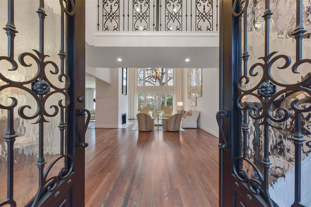 Double-front door entry welcomes you inside the soaring 2-story foyer with views throughout the home.