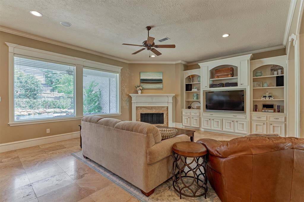 Expansive windows provide panoramic views to the backyard oasis from the den!