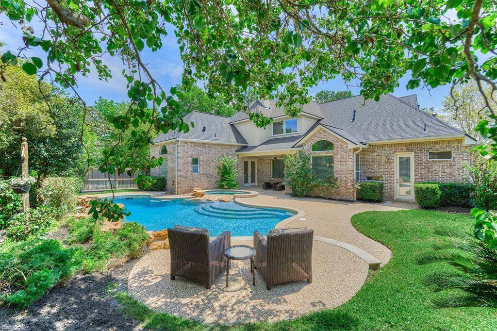 Private and serene resort-style backyard oasis awaits you with a lush landscaping surround!