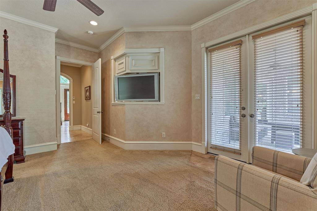Large sitting area with private, double exterior door to covered back patio.