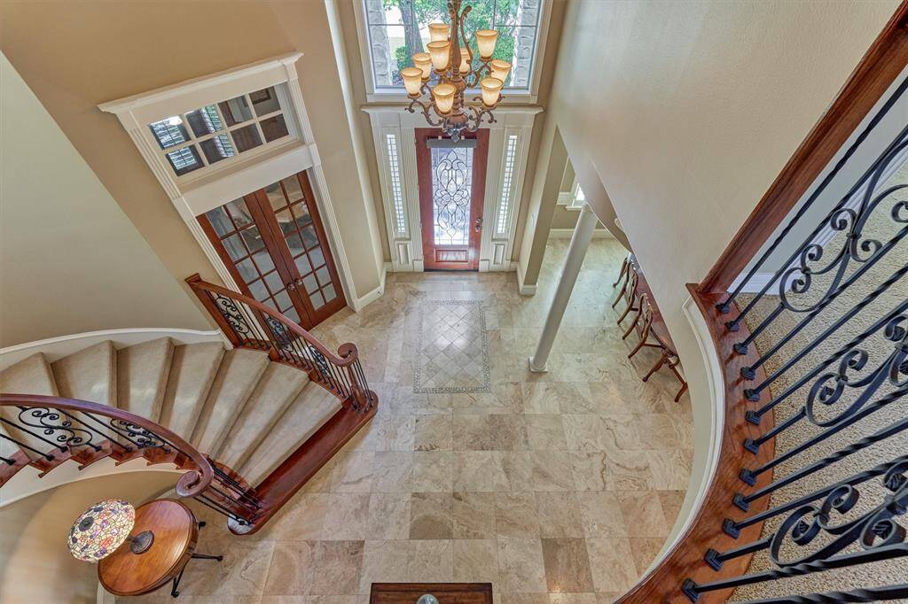 Incredible view of the grand 2-story foyer from the second floor landing.