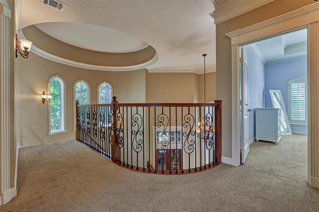 Second floor landing stuns with interior of the turret roof from the curved stairway.