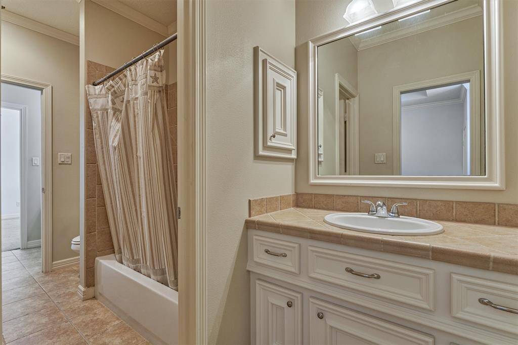 Jack & Jill bathroom for secondary bedrooms #2 and #3 with separate vanities and tub/shower combo.