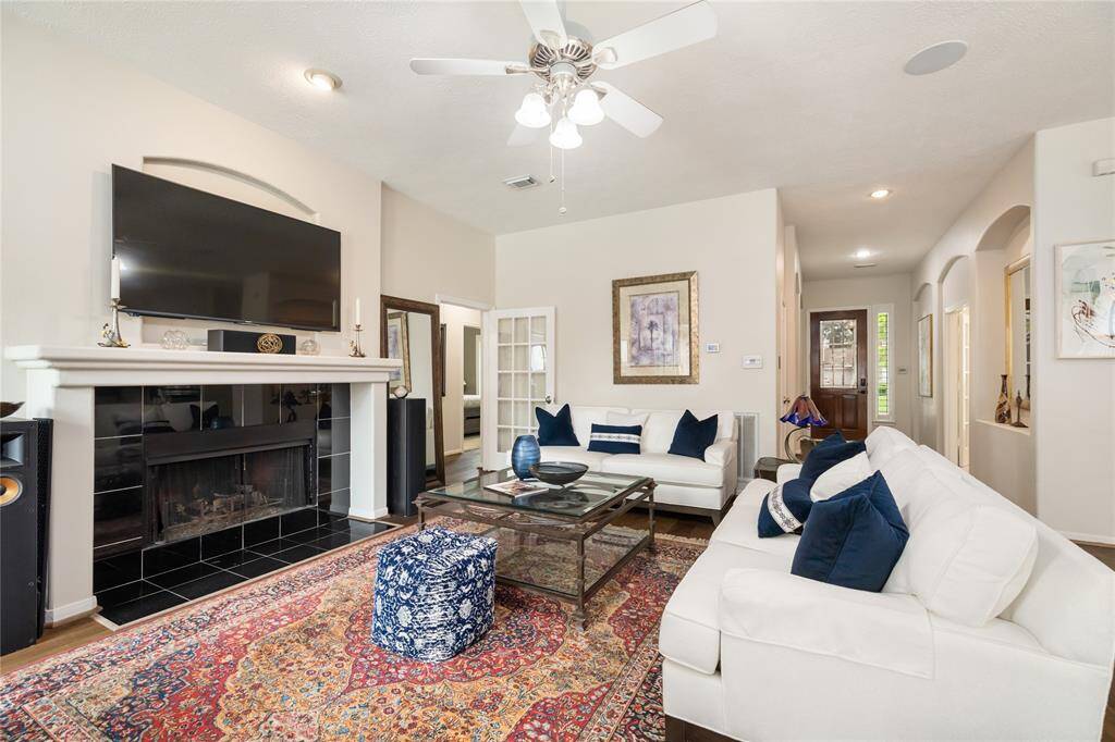 The cozy fireplace creates a warm, inviting atmosphere, perfect for relaxing or enjoying quiet moments.