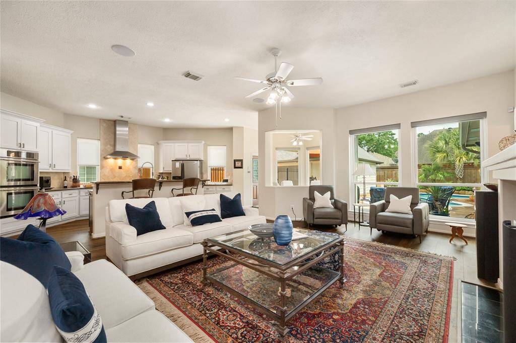 From this angle, the spacious living room offers a stunning view of the private pool, with large windows that invite natural light to flood the space.
