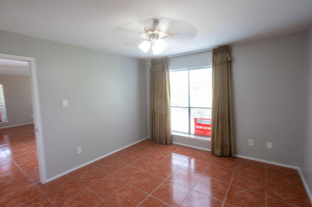 large bedroom with ceiling fan