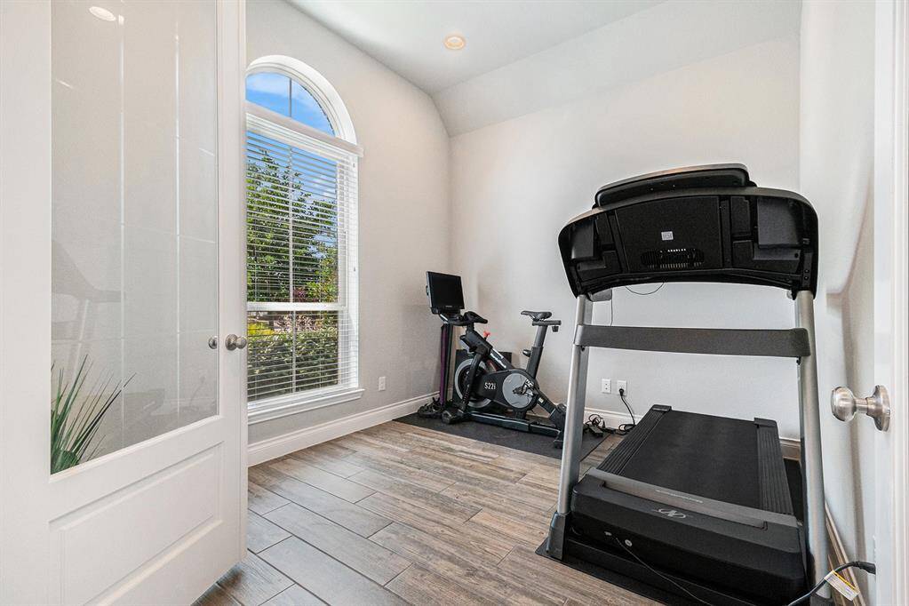 Beautiful study off the entry with 8' French Doors also works great as a home gym.