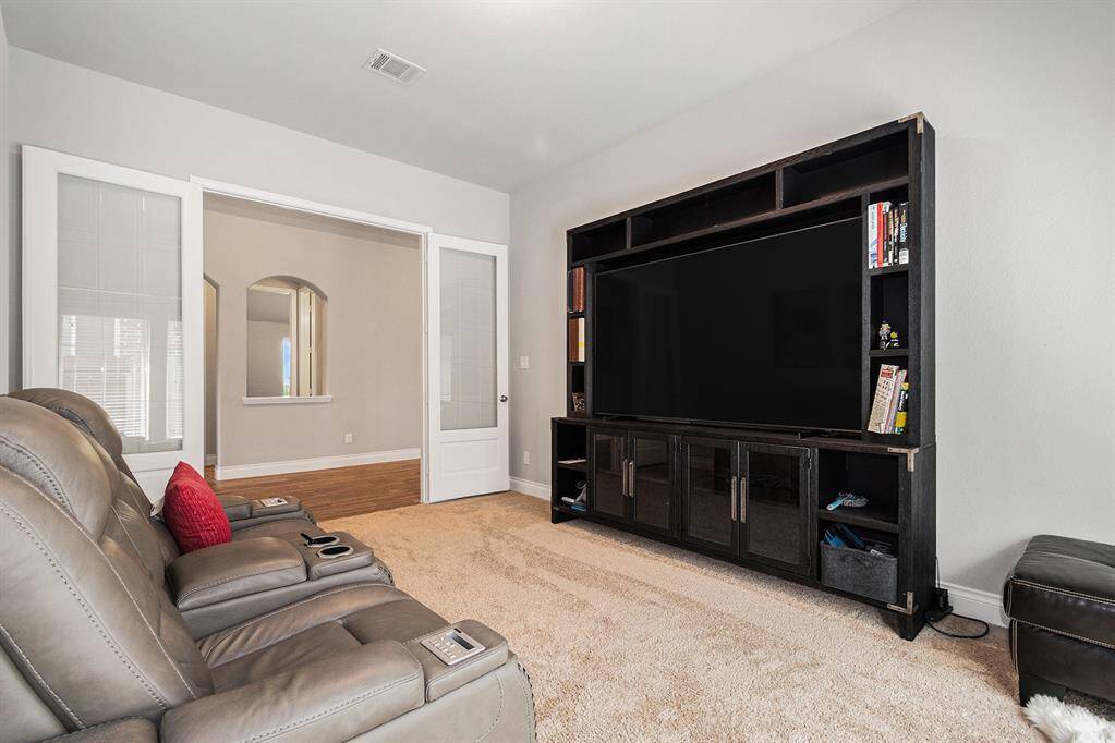 Another view of the large game / media room off extended entry with 8' French Doors.