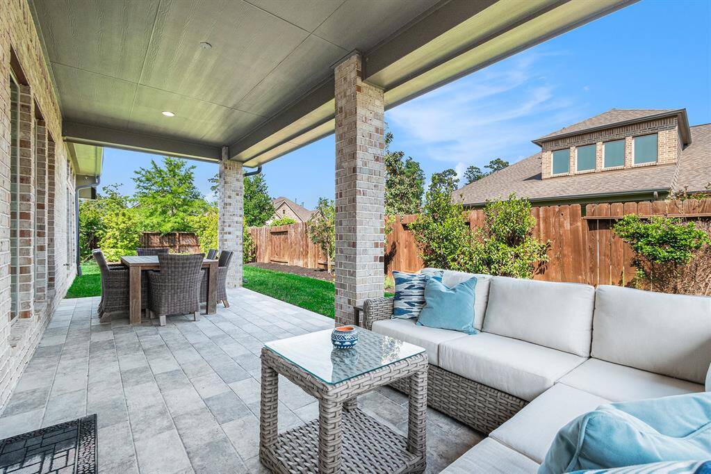 Oversized extended covered patio with outdoor tile.