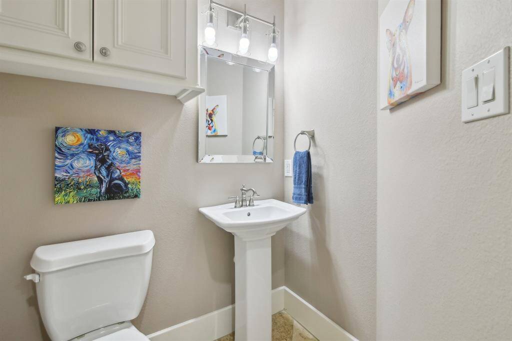 There is a half bath on the first floor for guests located near the entrance from garage.