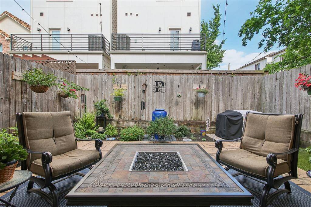 Relax and unwind in this beautifully designed outdoor patio oasis.