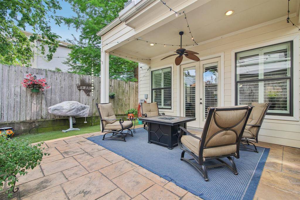 Centered around a cozy fire pit, this inviting space is perfect for evening gatherings