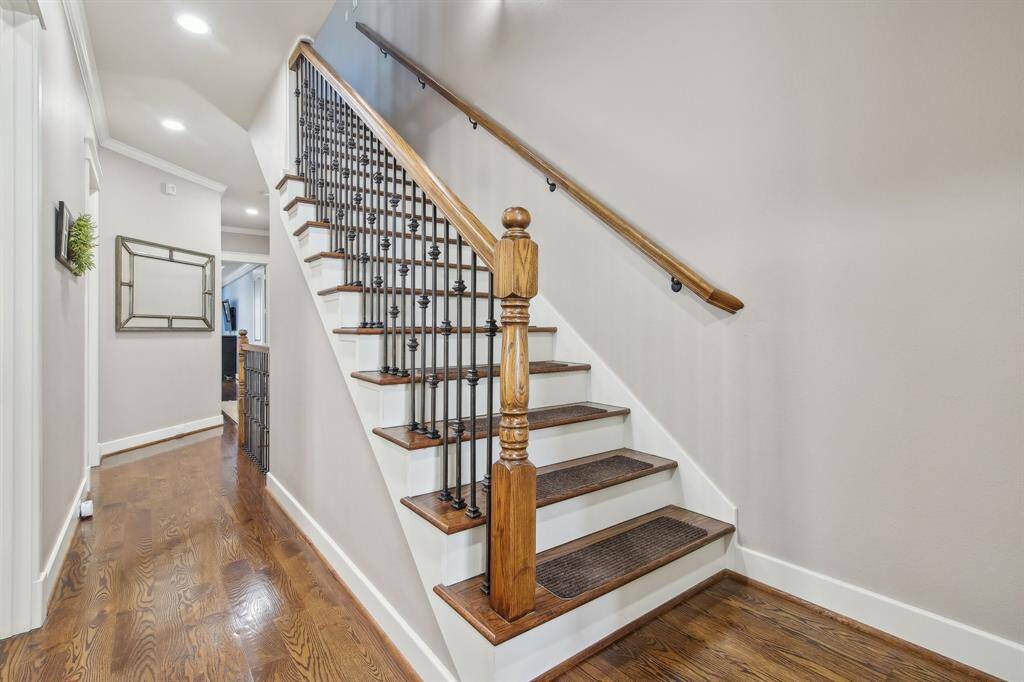 Enjoy the warmth and elegance of engineered hardwood flooring throughout the home, including the staircase.