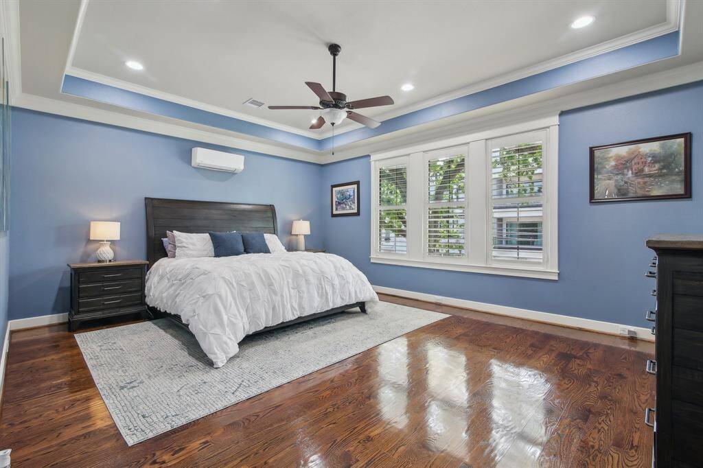 The spacious primary bedroom is nestled on the second floor, offering a private retreat filled with natural light.