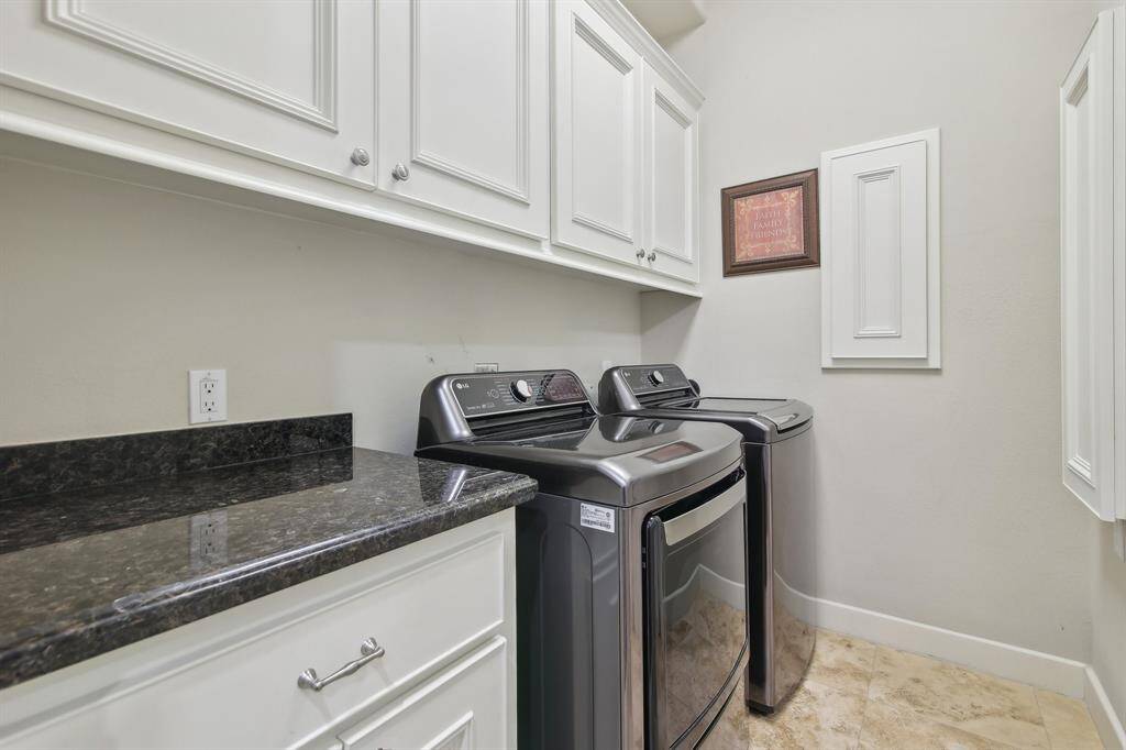 Conveniently located on the same floor as three bedrooms, the large laundry room offers both functionality and generous storage.