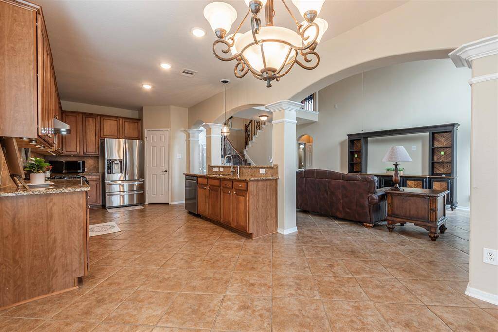 Breakfast area is adjacent to the large kitchen with recessed canned lighting.