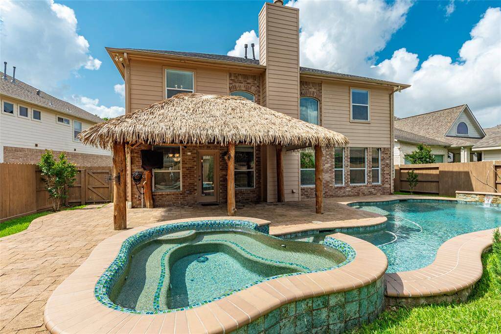Original owners show pride of ownership! Beautiful pool, hot tob and palapa with outdoor seating area and TV outlet.
