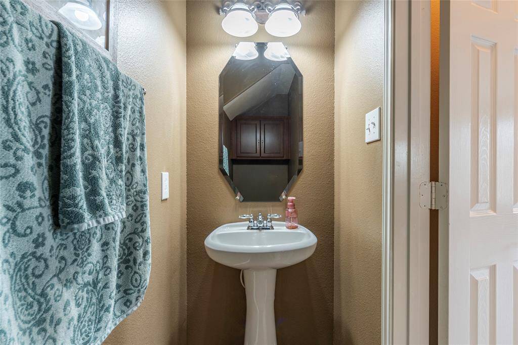 Half bath on the 1st level just off the living room area.