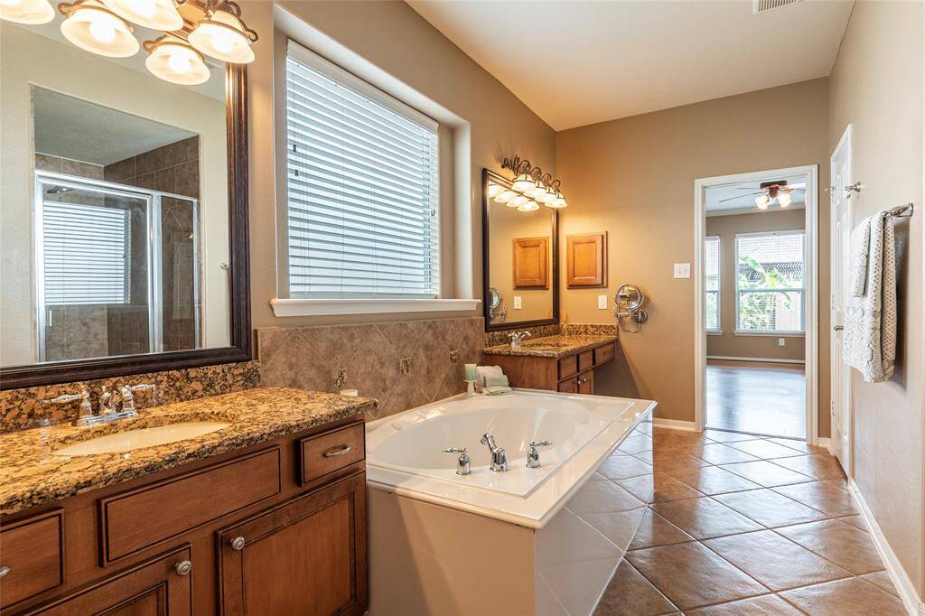 Another look at the large primary bathroom with large walk-in closet.