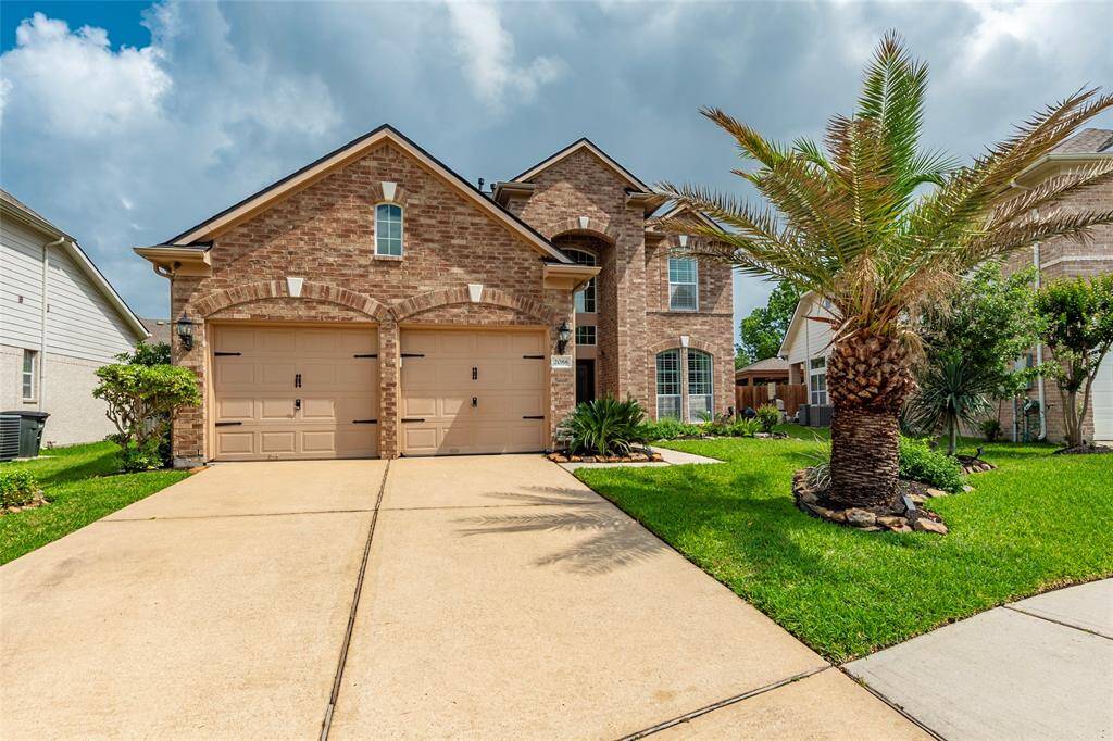 Double wide driveway with two car attached garage.