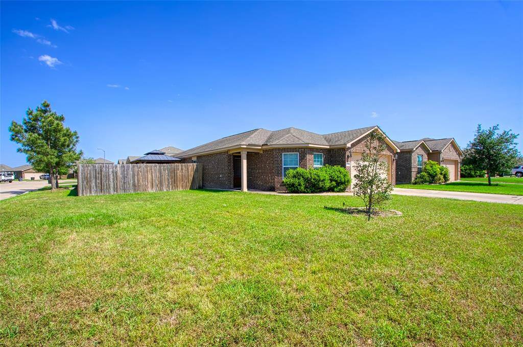 Spacious front lawn situated on a corner lot.