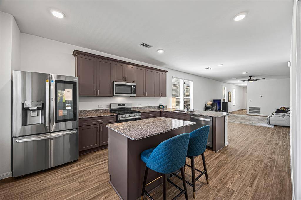 Enjoy this open-concept kitchen with a kitchen island.