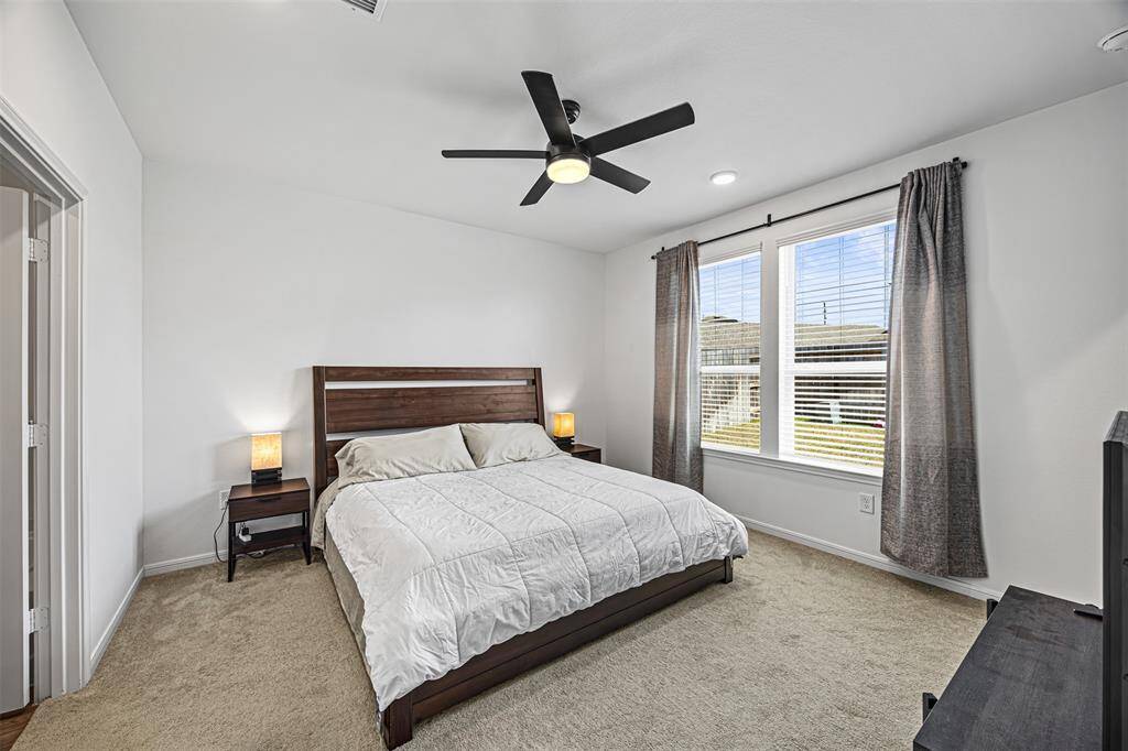 Enjoy this spacious main suite with a connected bathroom.