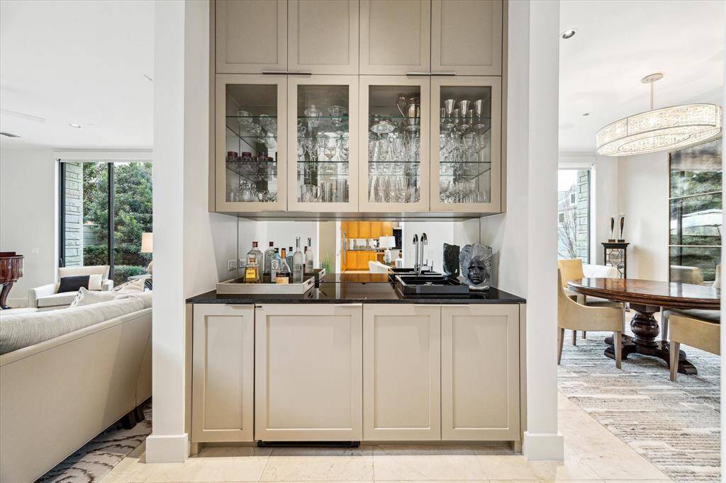 Bar area is centrally located to serve both living and dining rooms plus family room.
