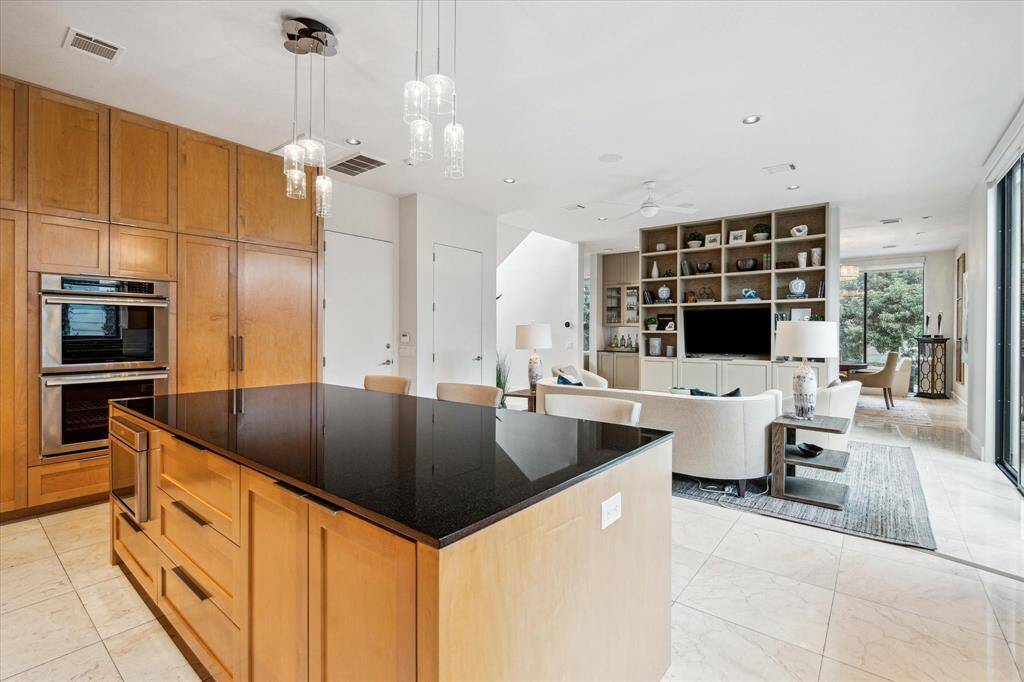 The chef's kitchen features a large island with lots of extra storage.