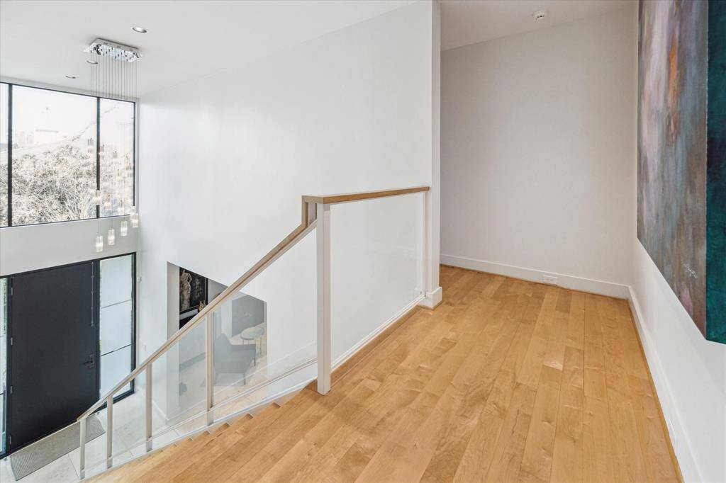Second floor landing. Hardwood floors throughout second floor. ( except utility room) The second floor elevator closet is located here.