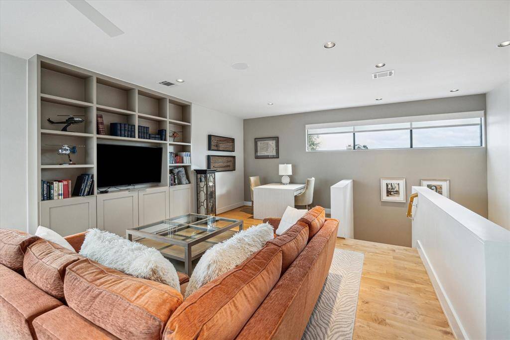 Third floor amenities include wet bar area with wine cooler, access to outdoor terrace, bookcases with custom TV framing, large bath with shower , elevator closet. The walk-in mechanical room is easily accessed from the third floor. Two tankless water heaters. 3 Trane A/C units.