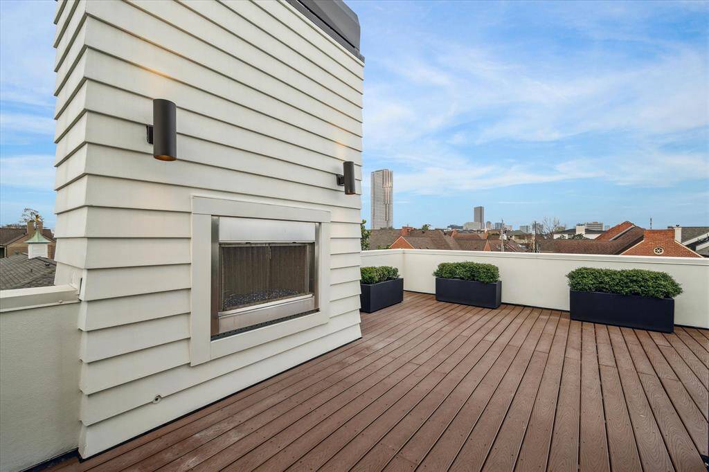 Outdoor gas fireplace on roof top deck