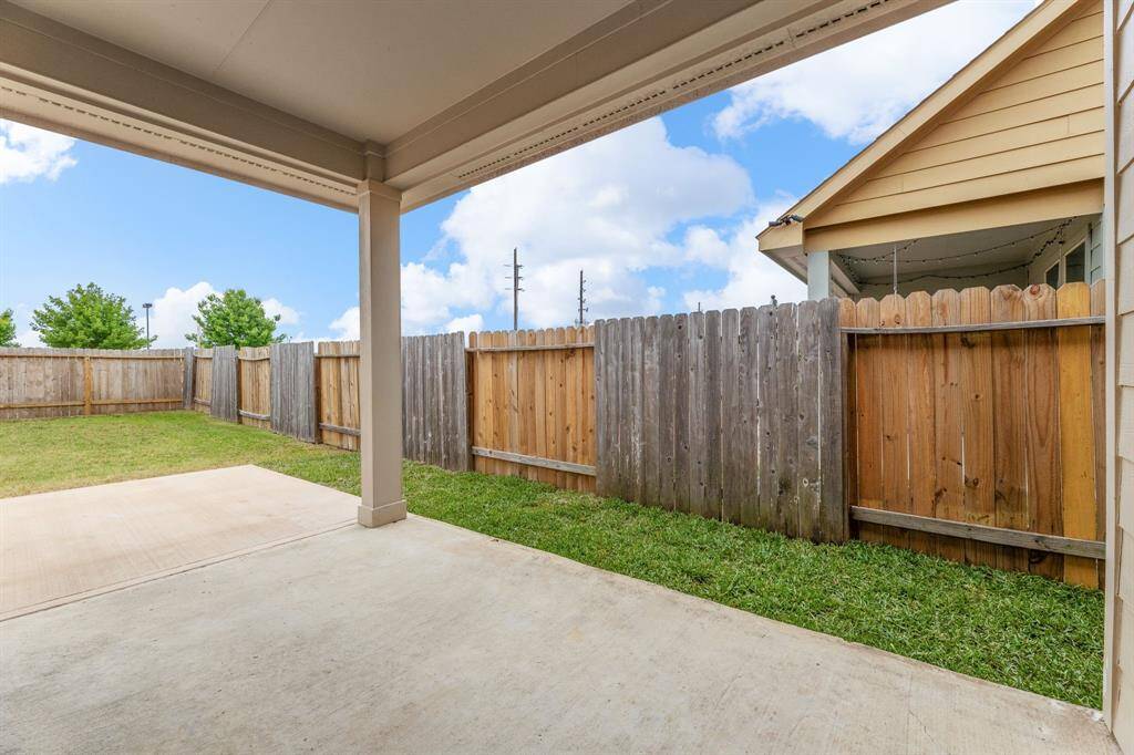 Back patio has an extended patio and ample room for any projects.