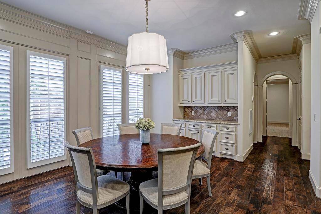 The kitchen is fully open to the dining area and seamlessly connects to the living room, creating a cohesive flow throughout the space.
