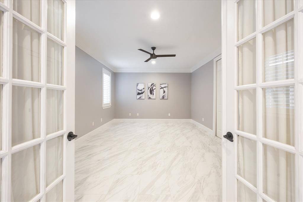 The second-floor bedroom boasts an ensuite bath and a walk-in closet.