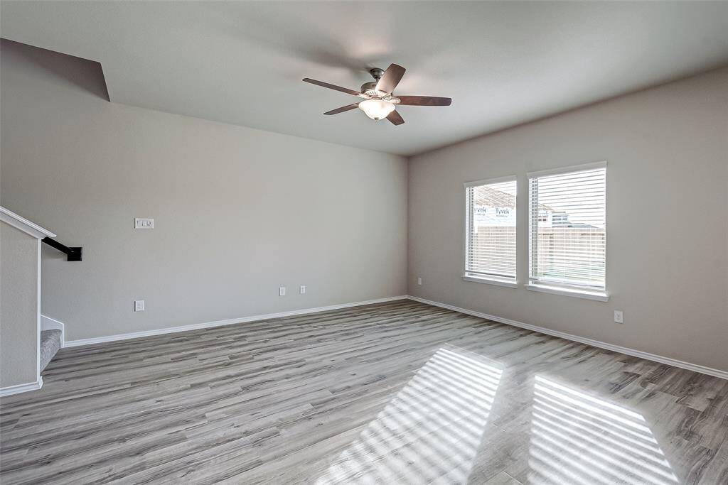 Living room. Notice how the floors carry throughout. Lots of natural light.