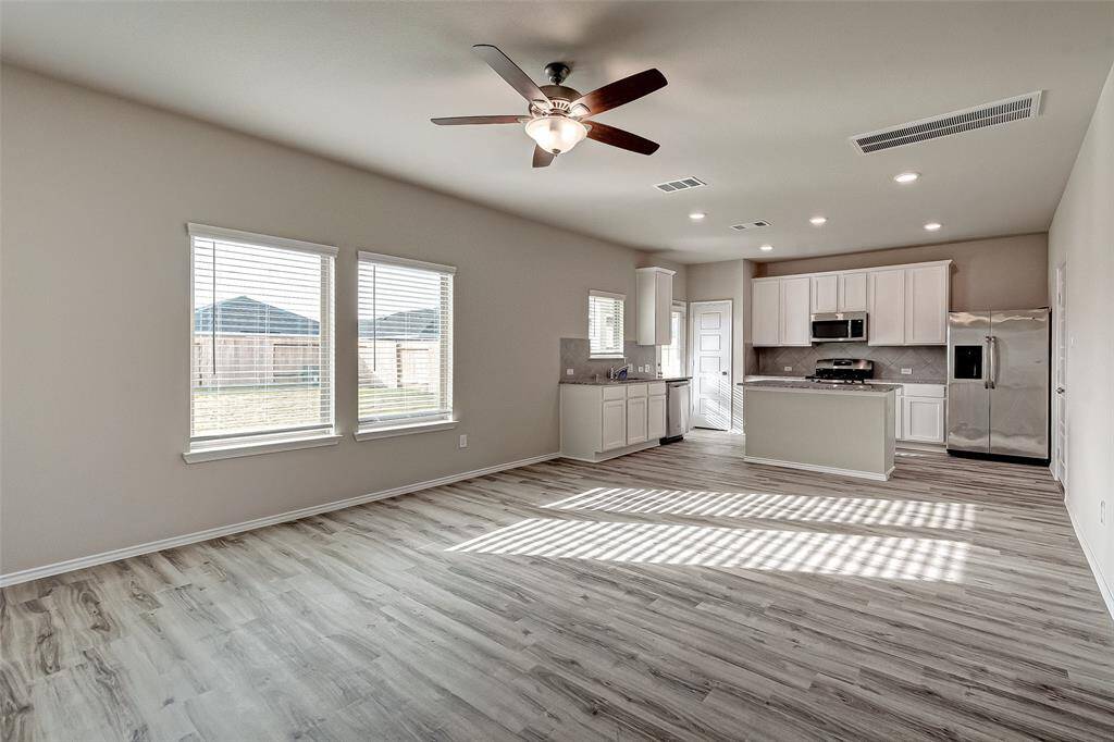 View from stairs into living and kitchen.