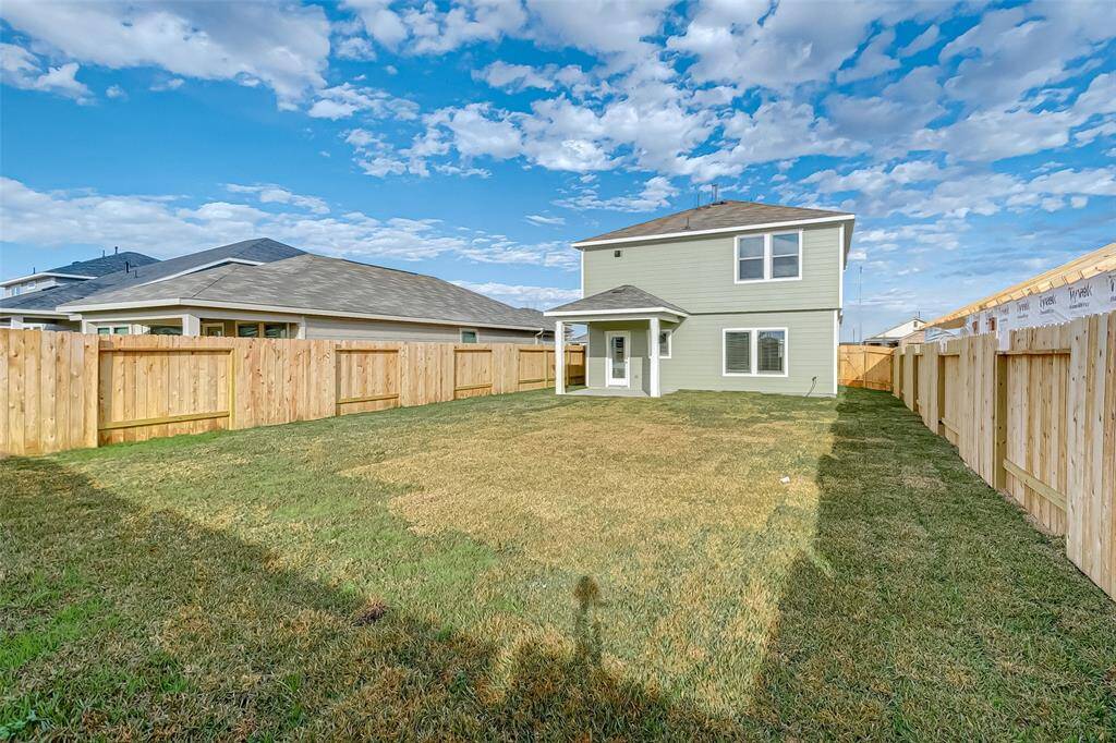 Alternate view of backyard and home. Notice the size of the space.